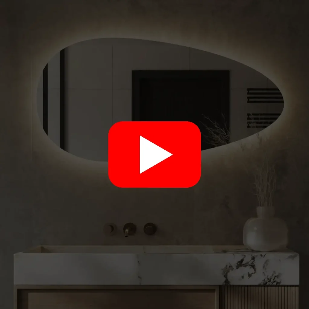 Video: Spejl med organisk form baglys lysstyring + antidug 120x60 cm Video af spejl i organisk form i 120×60 cm med antidug, baggrundsbelysning og dæmpbar lysstyring